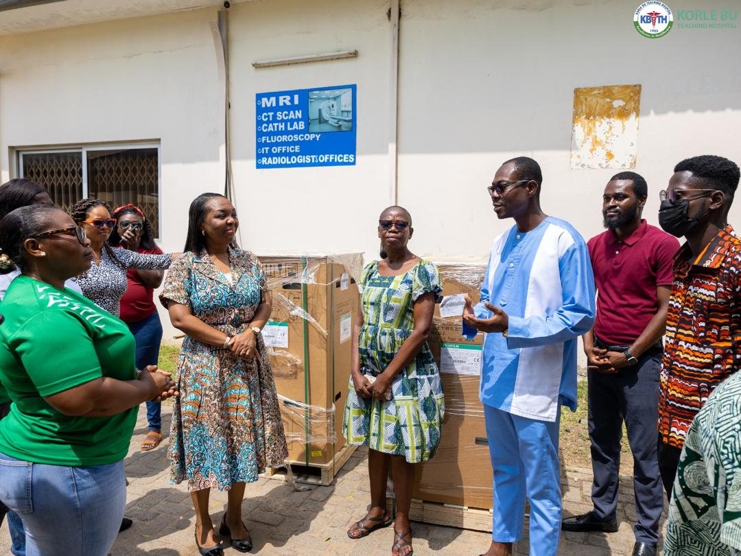 Vanderbilt team handing over two Fujifilm DryPix Edge printers at Korle Bu Teaching Hospital's radiology department